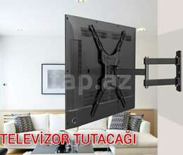 Televizorların divara yığılması